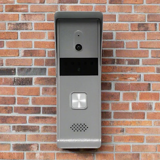 Hikvision DS-KB2421T-IM four-wire video door station installed on a brick wall