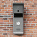 Hikvision DS-KB2421T-IM four-wire video door station installed on a brick wall